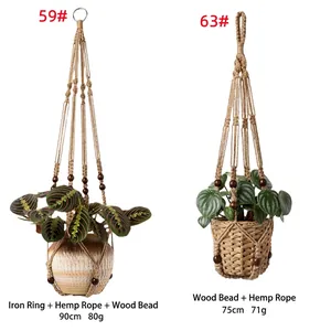 Detailed view of two different hand-woven hemp rope plant hangers with wooden beads.