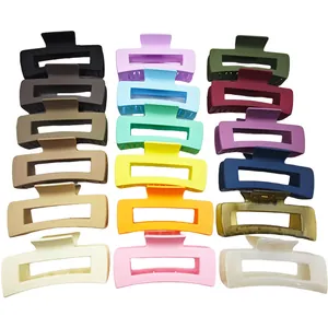 Detailed view of colorful rectangular matte and glossy hair claw clips set