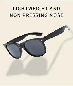 Detail view showing lightweight black vintage sunglasses with classic rivet accents and dark lenses