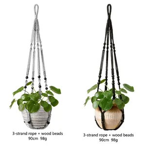 Set of two handwoven cotton macrame plant hangers with wooden beads in grey and black