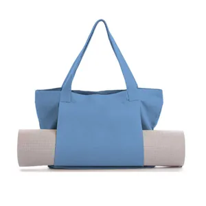 Blue canvas yoga mat tote bag with front storage slot for fitness and pilates