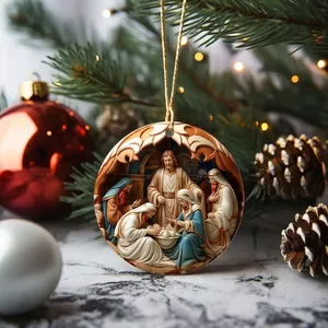 Close-up detail of a circular acrylic Nativity scene ornament hanging on a tree