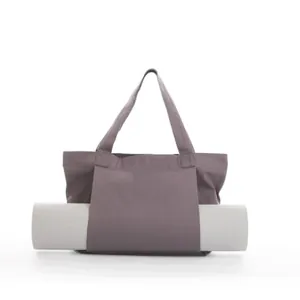 Durable large capacity canvas yoga tote bag designed for carrying fitness mats in purple