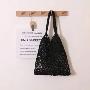 Handmade black cotton rope woven mesh shoulder bag for beach vacation and daily use