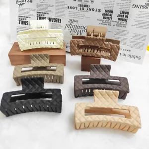 Large quilted texture hair claw clips set in various matte earth-tone colors for women