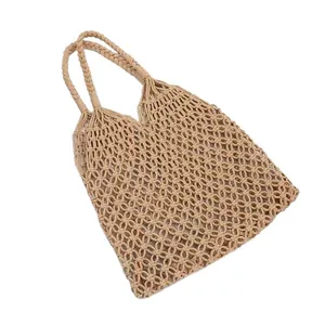 Handmade beige cotton rope woven shoulder bag with hollow circular knit design for vacation