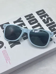 Detailed shot of baby blue candy-colored vintage sunglasses with silver rice nail accents