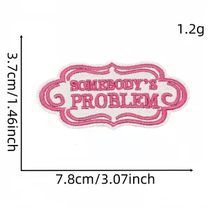 Pink embroidered patch with 'Somebody's Problem' text, size 7.8cm x 3.7cm, weight 1.2g