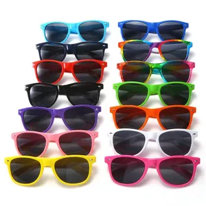 Bulk pack of retro classic sunglasses in assorted candy colors with silver rice nail rivets.