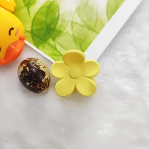 Cute yellow flower hair claw clip with a matte finish for daily hair styling.