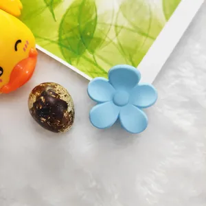 Cute light blue flower-shaped hair claw clip with a matte finish for women's daily hair styling