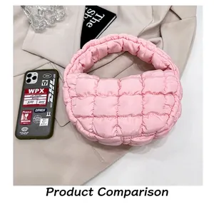 Detail of a pink quilted cloud handbag with soft down cotton padding and handle