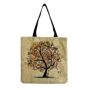 Linen-textured tote bag featuring a colorful musical note tree print with black straps