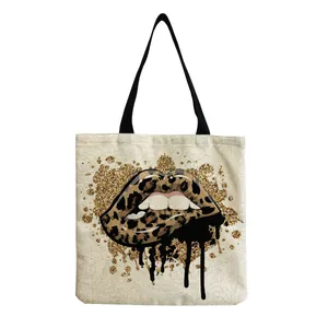 Close-up of leopard print lips with gold glitter and black drips on canvas bag