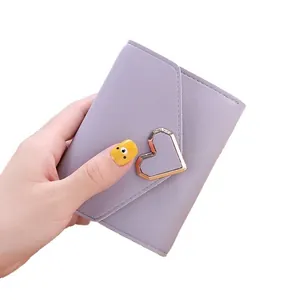 Lavender short tri-fold women's wallet with elegant metallic heart-shaped clasp closure.