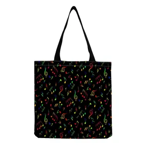 Minimalist black tote bag with vibrant rainbow music note print and black straps