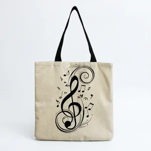 Detail view of a linen tote bag with artistic musical note print
