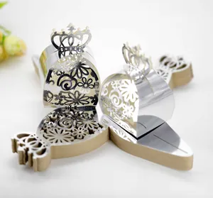 Detailed view of silver laser-cut wedding favor box featuring an elegant crown hollow design