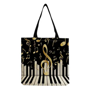 Detailed close-up showing the artistic musical note and piano key print on canvas tote bag