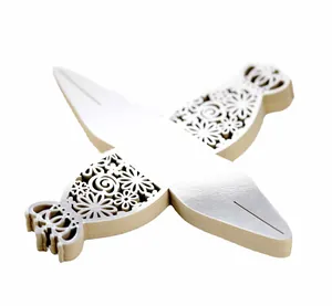 Close-up of white laser-cut wedding candy box with elegant hollow floral patterns