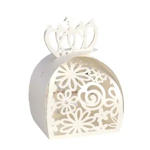 Detailed view of the intricate laser-cut floral patterns on the white wedding candy box.