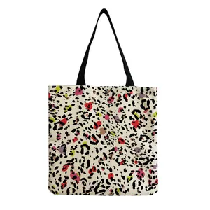 Close-up of trendy colorful leopard eye print on a stylish large capacity tote bag.