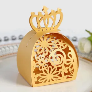 Elegant gold laser-cut candy box featuring intricate floral patterns and crown top detail