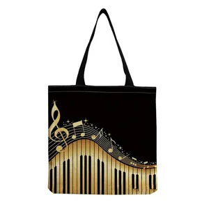 Detail view of foldable canvas tote bag with golden piano keyboard and music notes print