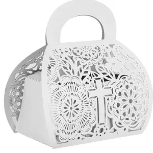 Elegant white laser-cut hollow candy gift box with intricate cross and floral patterns