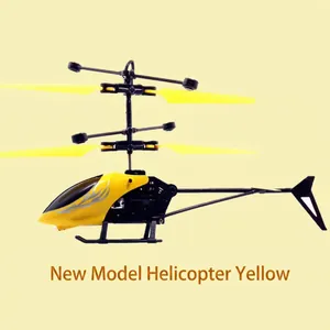 Side view of yellow induction helicopter toy with black rotors on light yellow background.