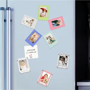 Colorful 3-inch magnetic Polaroid photo frames displayed on a light blue refrigerator.