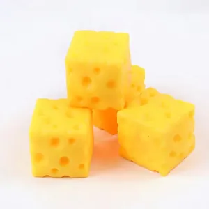 Close-up detail of realistic yellow cheese-shaped TPR stress relief squeeze toys.