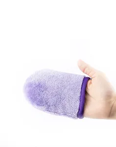 Close-up of soft purple flannel makeup remover glove showing the fine plush texture