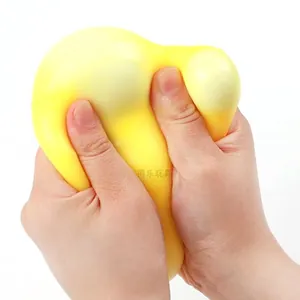 Close-up view showing the soft texture and flexibility of yellow TPR cheese squishy toy.