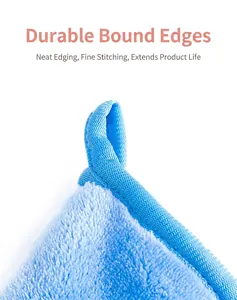 Macro view showing high-quality stitching and hanging loop on blue flannel makeup remover glove