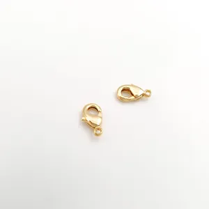 Close-up of two shiny 18K gold-plated lobster clasps for jewelry DIY projects.