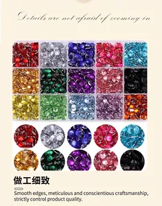 Macro detail of a 15-grid box containing colorful resin rhinestones for nail art DIY