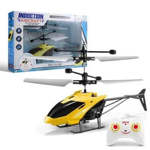 Yellow induction RC helicopter toy for kids with white remote control and packaging box