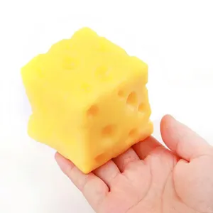 Realistic cheese-shaped TPR stress relief squishy toy held in hand
