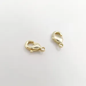 High-quality detailed macro view of two 18K gold plated lobster clasps for DIY jewelry
