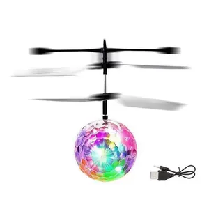 Close-up detail of a colorful LED induction flying ball toy with its USB charging cable