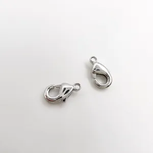 Detailed macro view of two silver lobster clasps for professional DIY jewelry making
