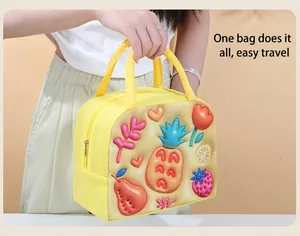 Close-up of insulated lunch bag with 3D embossed pineapple and strawberry patterns