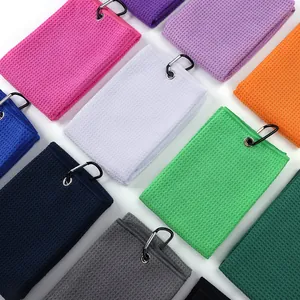 Assorted microfiber golf towels featuring waffle weave texture and sturdy carabiner clips
