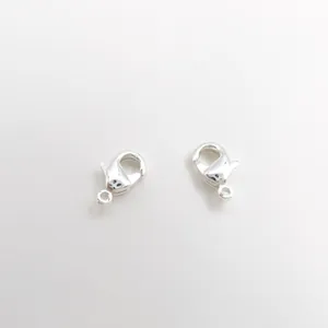 Close-up of two silver lobster clasps for DIY jewelry making accessories