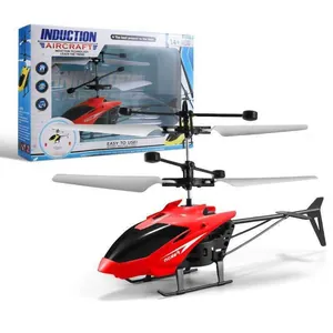 Red induction helicopter toy with dual propellers and retail packaging box