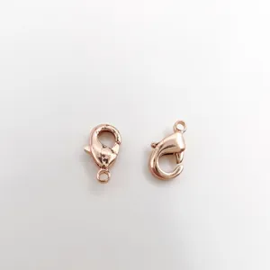 Close-up of two rose gold 18K gold plated lobster clasps for DIY jewelry making