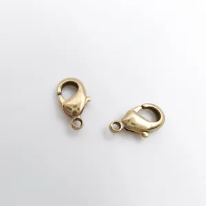 High-quality close-up of 18K gold plated copper lobster clasps for DIY jewelry making.