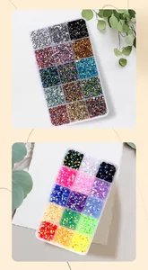 Detailed view of two 15-compartment kits with colorful resin flat-back rhinestones