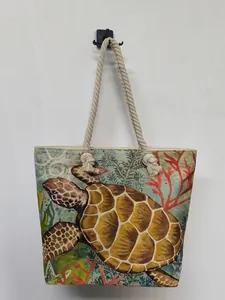 Detailed view of the sea turtle print on a vintage large capacity beach tote bag